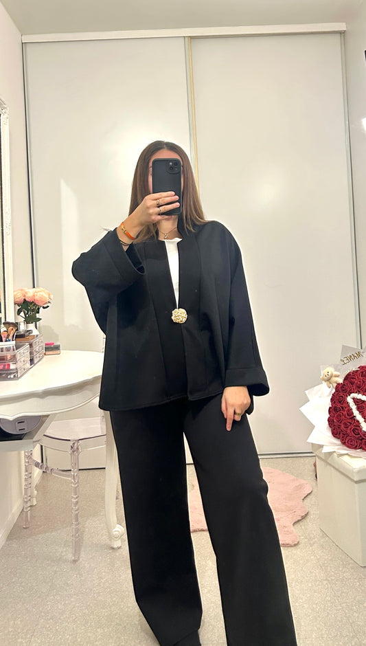 Black long-sleeved set with brooch